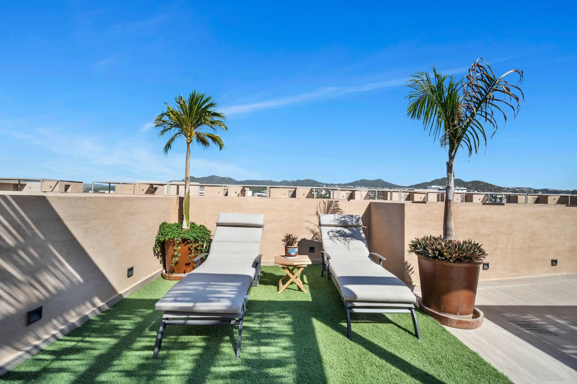 Ocean-view rooftop loungers at Eagles Nest Cabo near Medano Beach