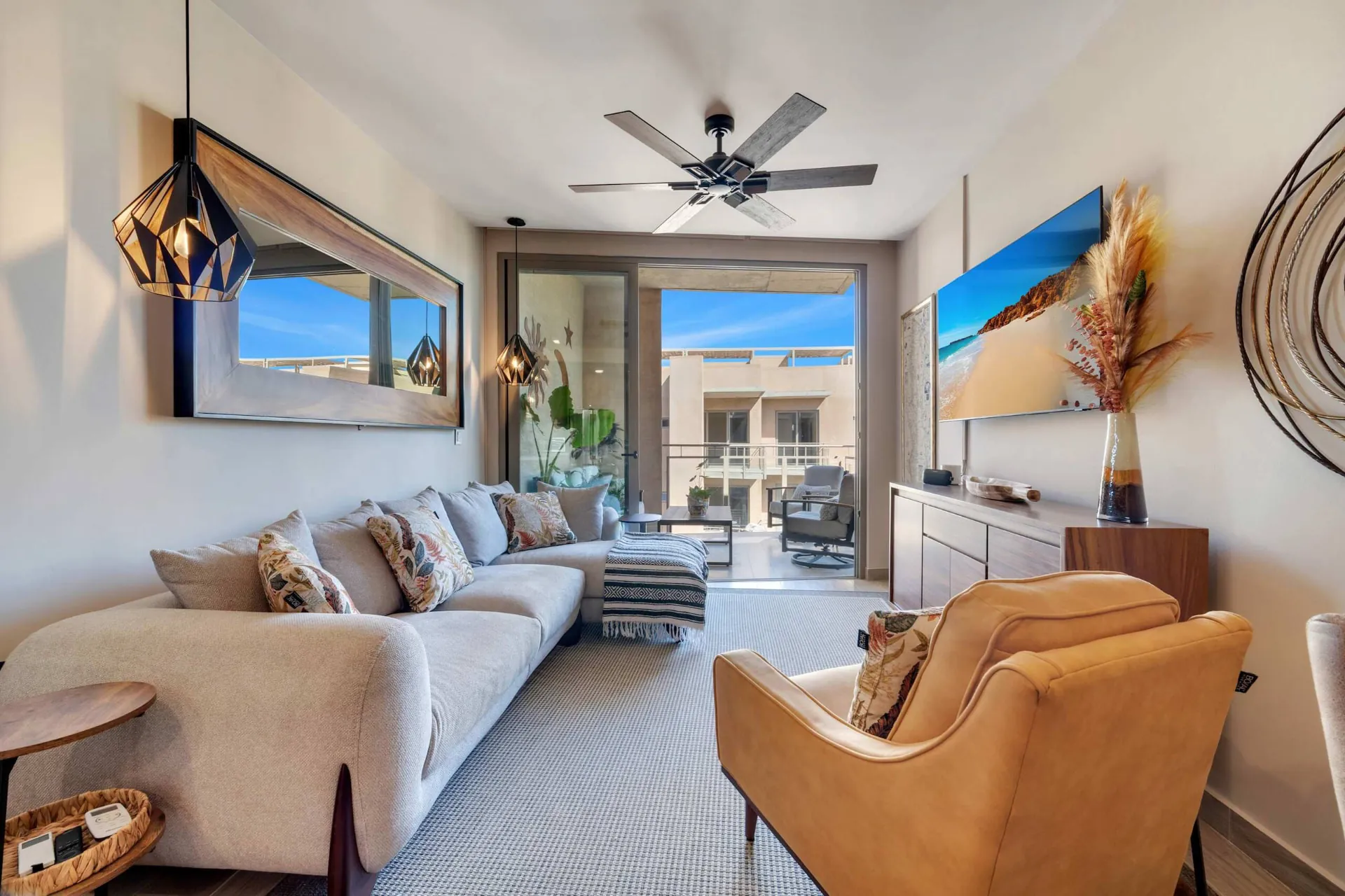 Clean modern living space inside Eagles Nest Cabo with terrace access
